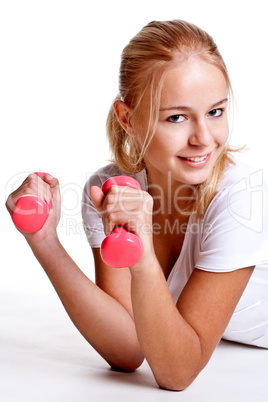 pink dumbbells in the hands of women