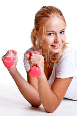 pink dumbbells in the hands of women pink dumbbells in the hands of women