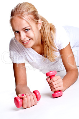 pink dumbbells in the hands of women