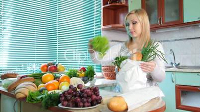 Pregnant woman with Groceries in kitchen