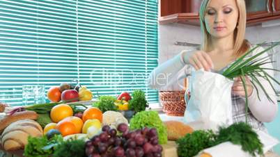 Pregnant woman with Groceries in kitchen