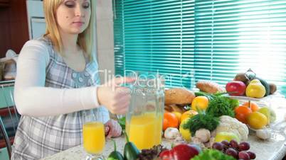 Pregnant woman drinking orange juice