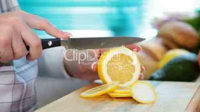 Women hands sliced lemon