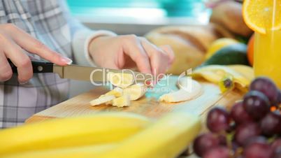 woman hands sliced banana