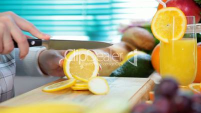 Women hands sliced lemon