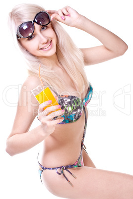 beautiful women in swimsuit with a glass of juice