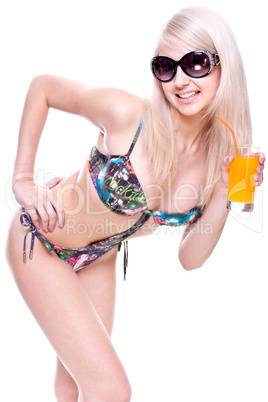 beautiful women in swimsuit with a glass of juice