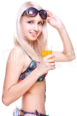 beautiful women in swimsuit with a glass of juice