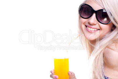 beautiful women in swimsuit with a glass of juice