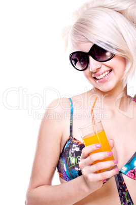 beautiful women in swimsuit with a glass of juice