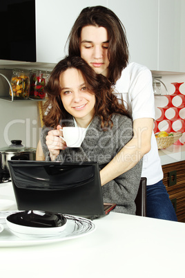 Happy couple in their kitchen