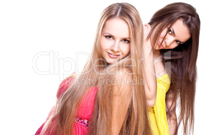 two beautiful women in a colored dress