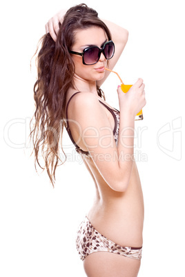 beautiful women in swimsuit with a glass of juice