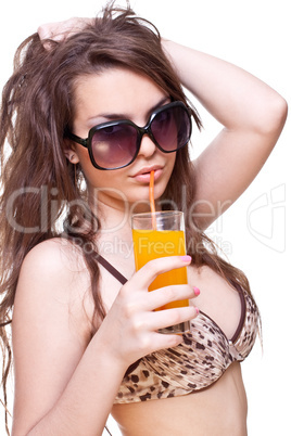 beautiful women in swimsuit with a glass of juice