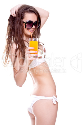 beautiful women in swimsuit with a glass of juice