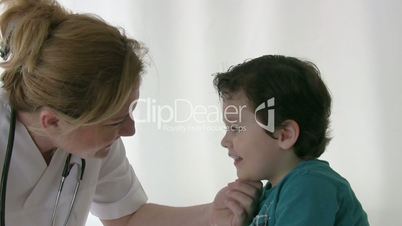 Pediatrician checking Little boy