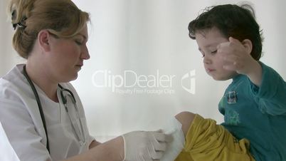 Doctor bandage on child leg
