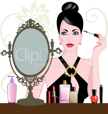 Glamour woman applying makeup