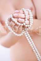 pearls in the women's hands