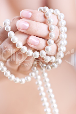 pearls in the women's hands