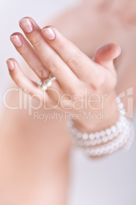 pearls in the women's hands