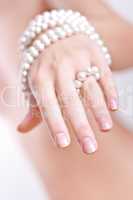 pearls in the women's hands