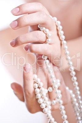 pearls in the women's hands