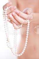 pearls in the women's hands