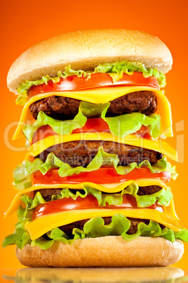 Tasty and appetizing hamburger on a yellow