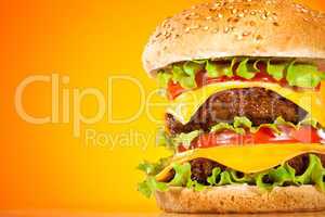 Tasty and appetizing hamburger on a yellow