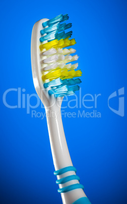 toothbrush on a dark blue background