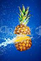 Pineapple splashed with water