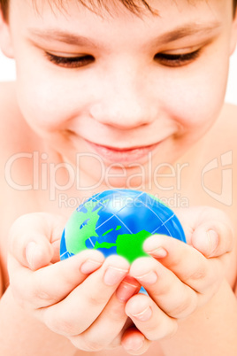 boy holds globe in hands