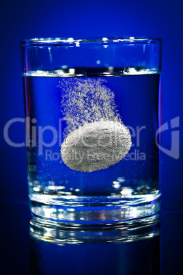 Tablet in a water glass