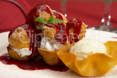 Tasty profiteroles on a dining table