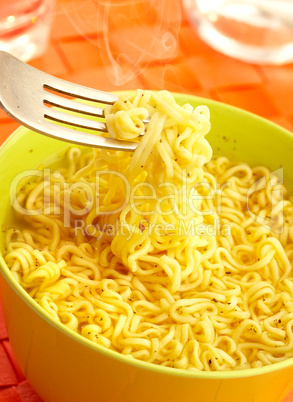 Hot and tasty noodles on a plug.