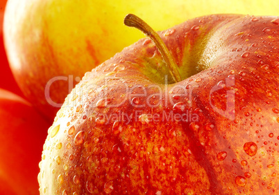Fresh apple with drops of water.