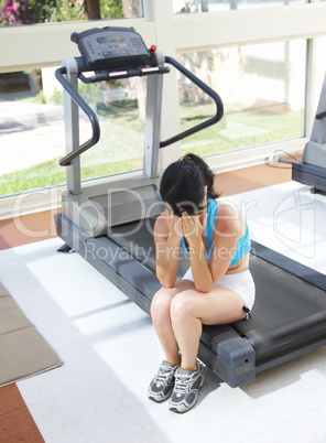 girl cries at a sports training apparatus