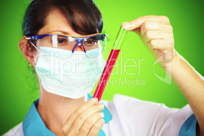 scientist in laboratory with test tubes