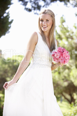 Bride Wearing Dress Holding Bouqet At Wedding