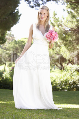 Bride Wearing Dress Holding Bouqet At Wedding