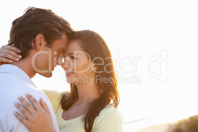 Romantic Young couple in love at sunset