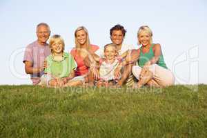 A family, with parents, children and grandparents, posing in a f
