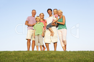 A family, with parents, children and grandparents, posing in a f