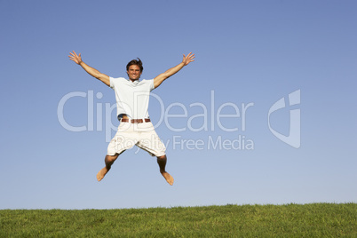 Young man jumping in air