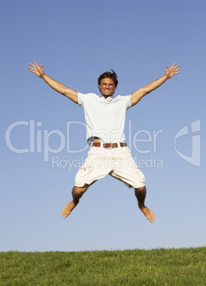 Young man jumping in air