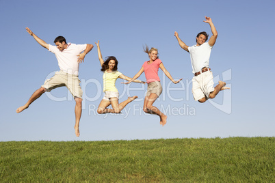 Young couples jumping in air