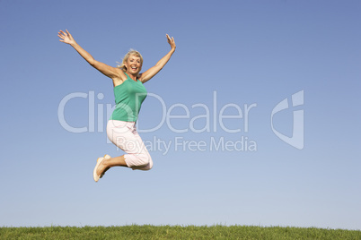 Senior woman  jumping in air