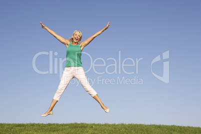 Senior woman  jumping in air