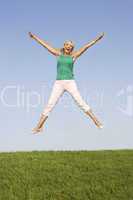 Senior woman  jumping in air